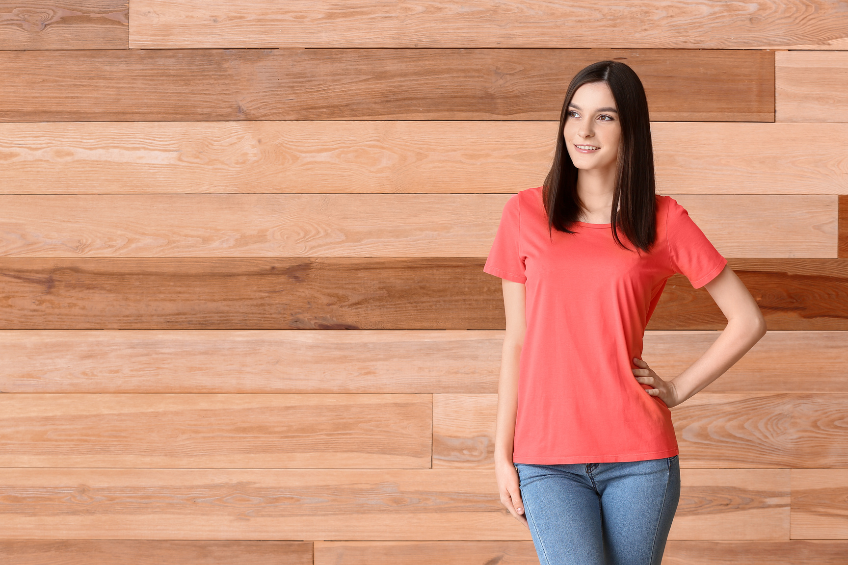 Woman in Red T-Shirt on Wooden Background