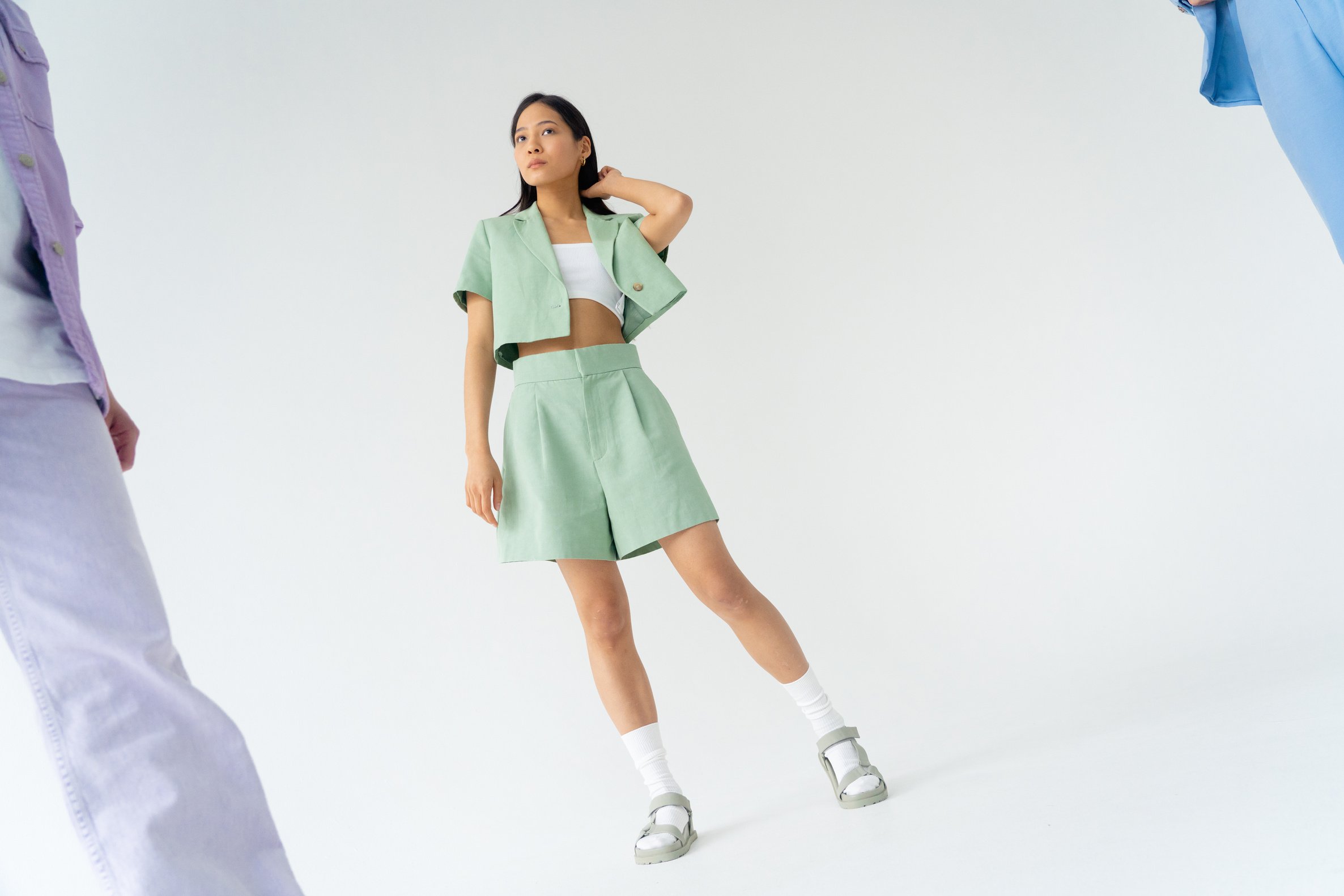 A Low Angle Shot of a Woman in Pastel Green Top and Shorts