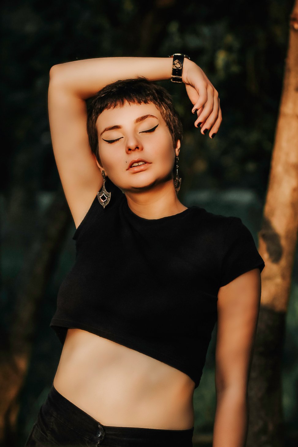 standing woman wearing black crop top